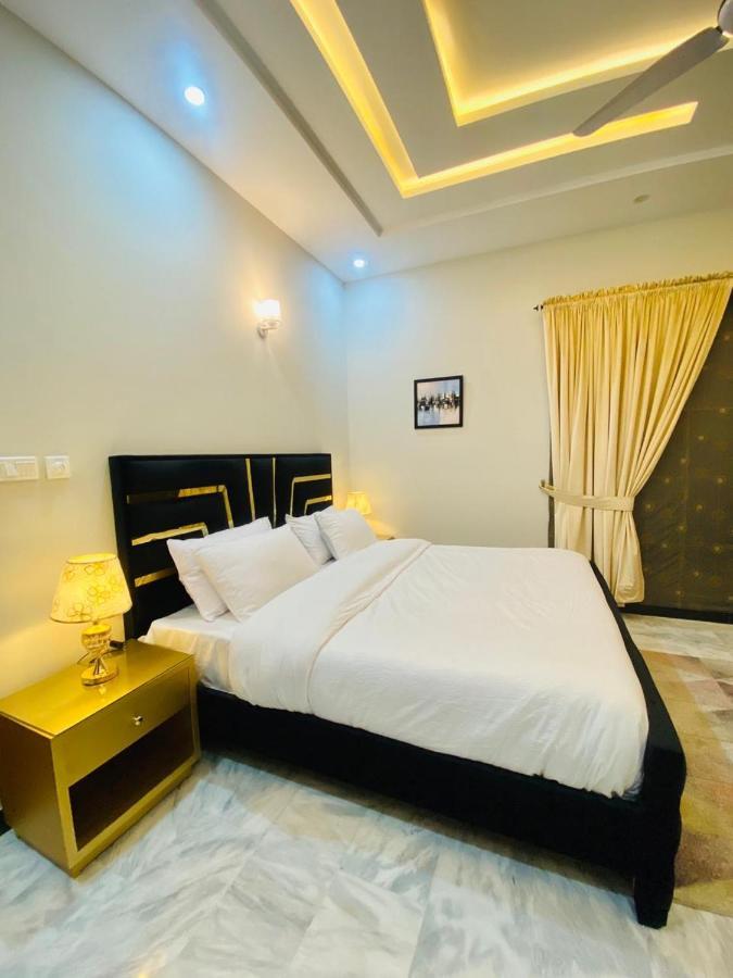 Homey Islamabad Habitación foto